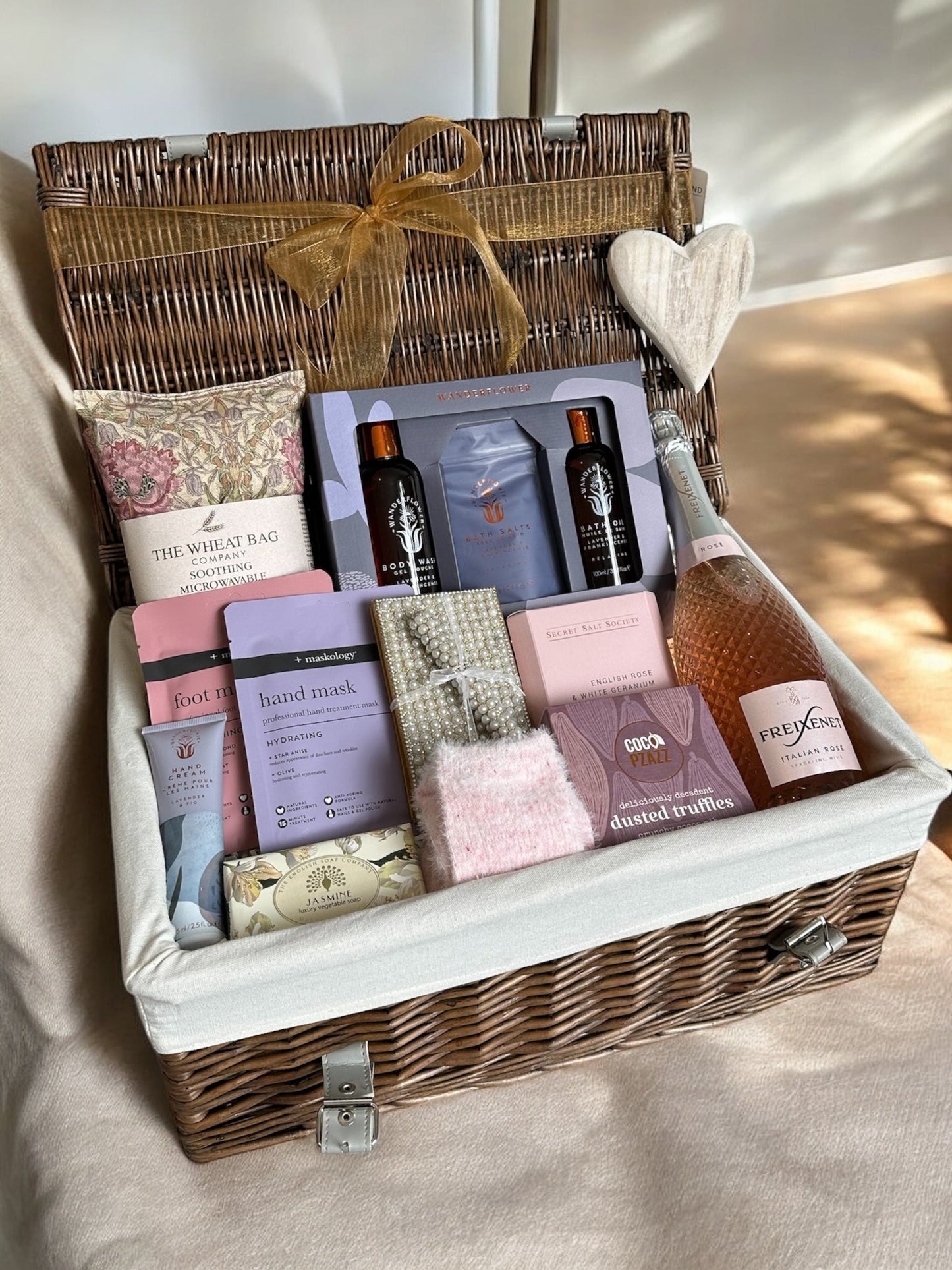 Luxury Top to Toe Indulgence hamper with lavender products, house socks, wheat bag, bath infusion, hand cream, Prosecco, and truffles.
