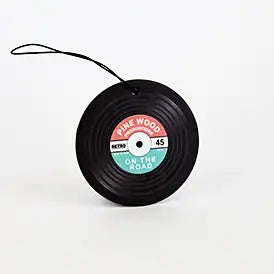 Vinyl car air freshener with pinewood scent.