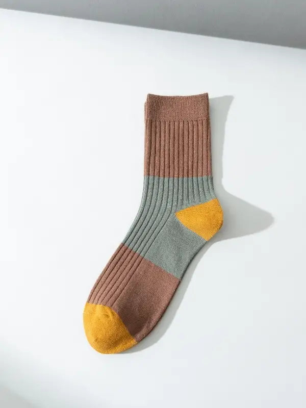 Men's stylish warm knitted cotton socks in a color-block pattern with brown, grey, and yellow accents.