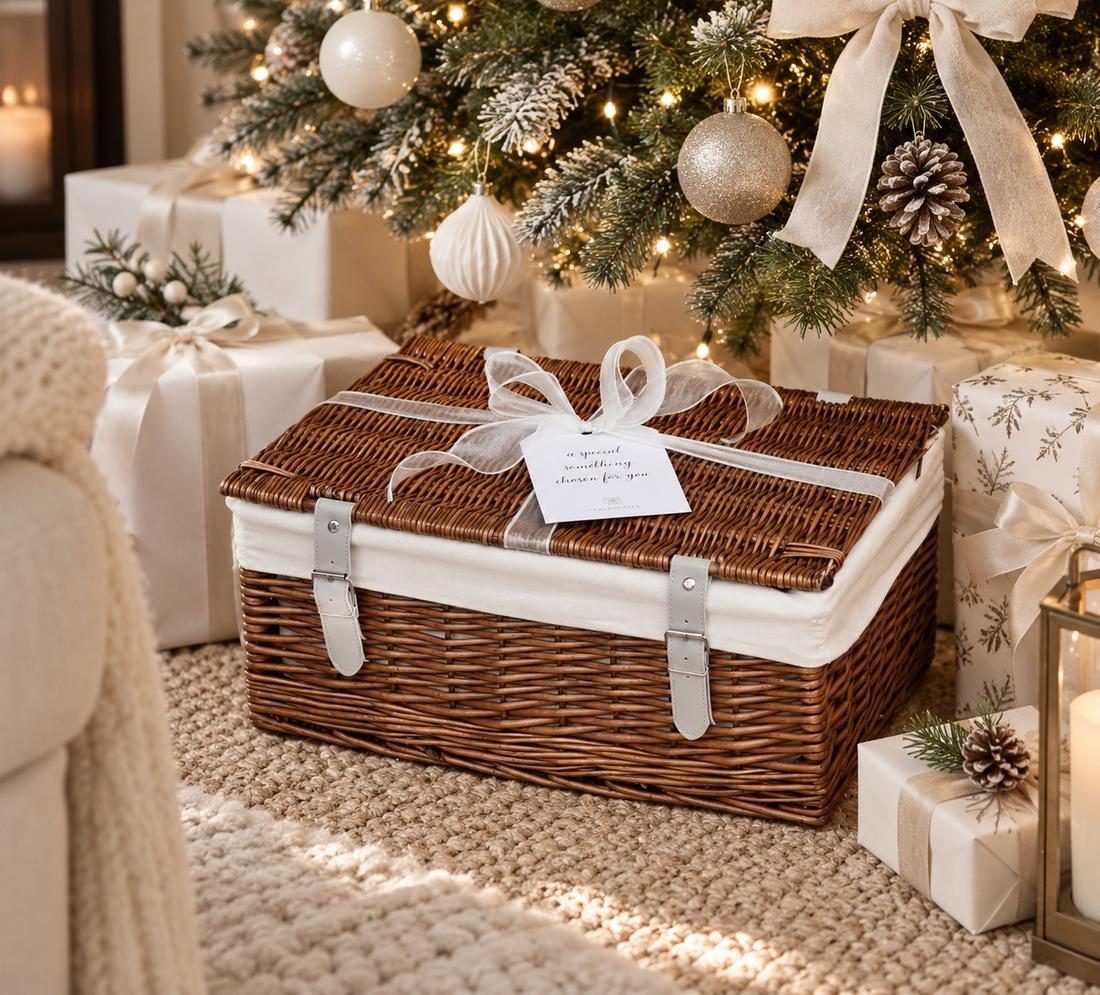 hamper closed under a christmas tree with festive decorations