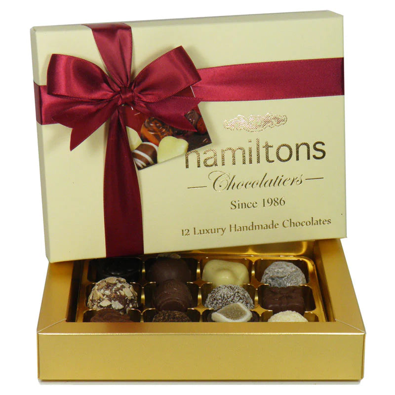 Box of Hamiltons chocolates with a red ribbon on a white background