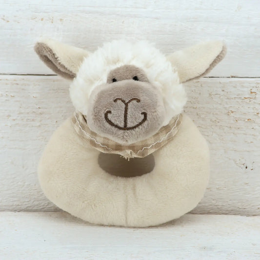 Sheep plush baby rattle toy with cute embroidered face and soft beige material.
