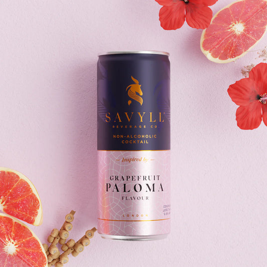 Grapefruit Paloma Mocktail can with pink grapefruit and floral accents.