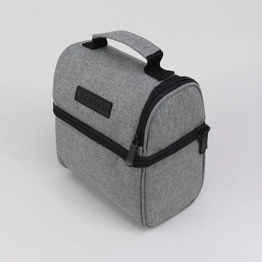 Grey lunch cooler bag with insulating properties for keeping food fresh, easy-to-carry design for work and travel.