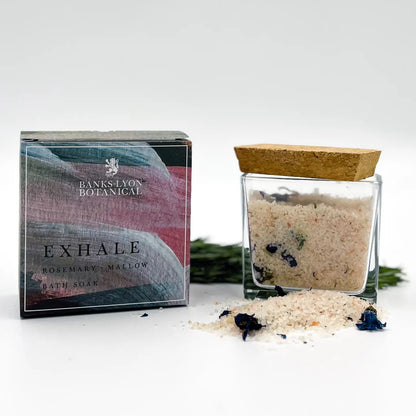 Exhale Bath Soak in glass jar with natural clays, botanicals, and essential oils for relaxation.
