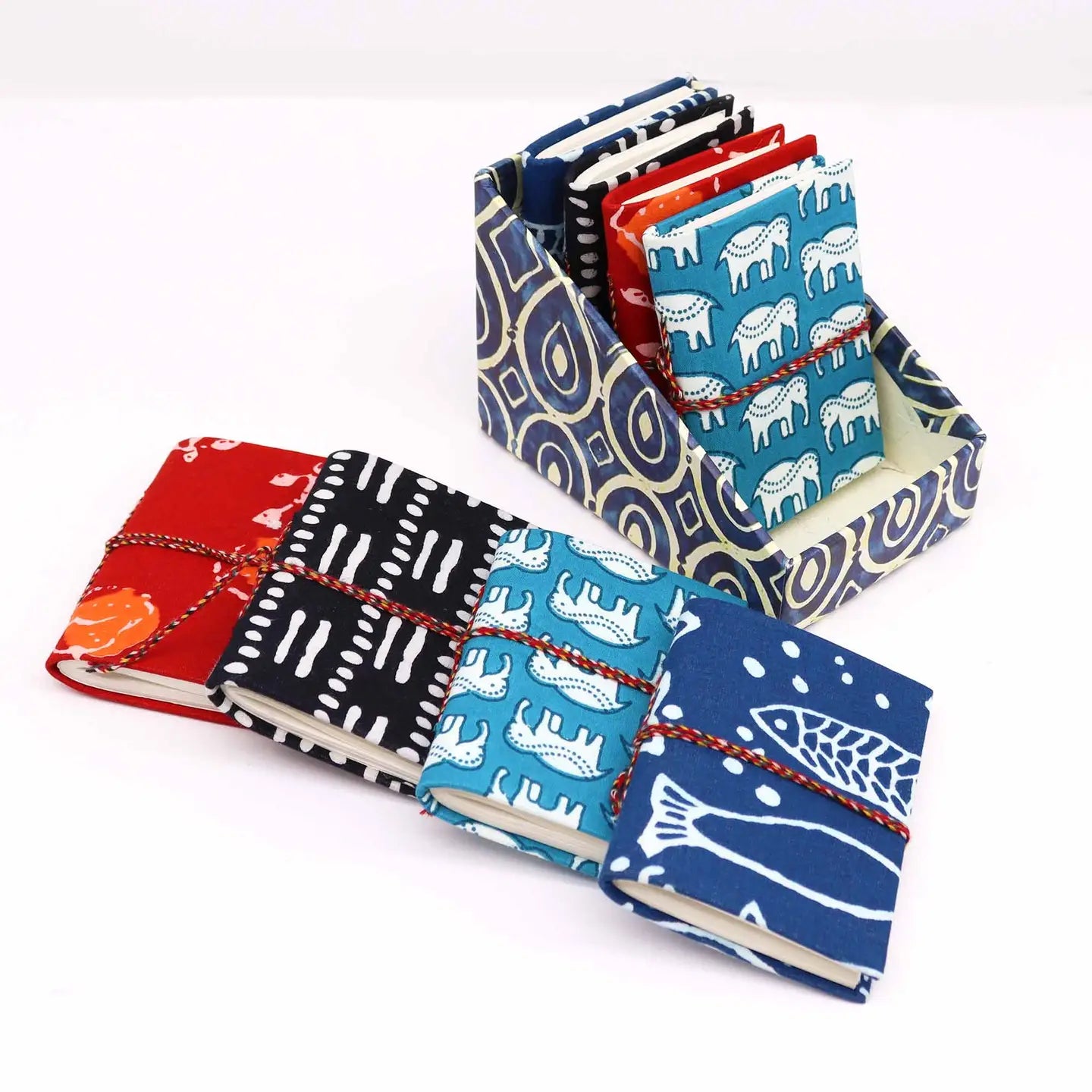 Colourful cotton bound mini notebooks with block print design in black.