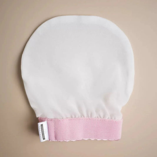 Silk exfoliating mitt for luxurious skin pampering and skincare routine.