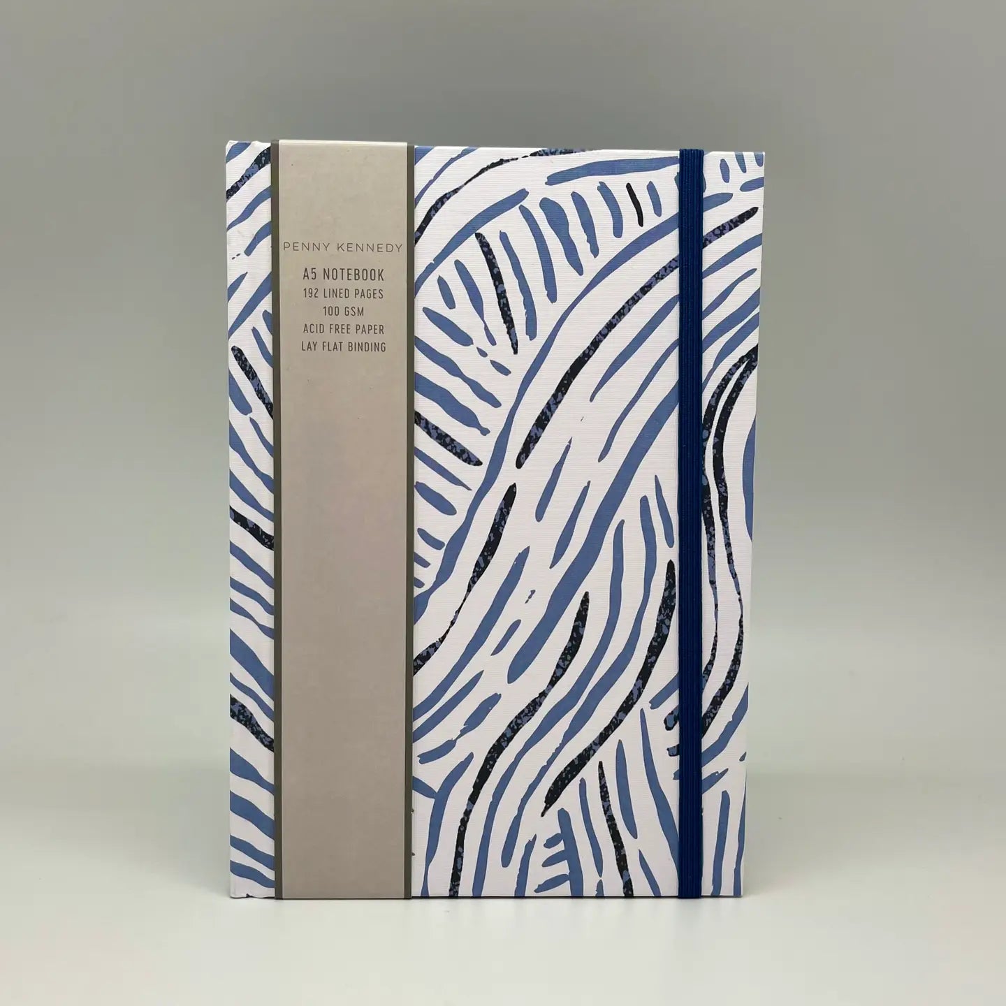 A5 hardcover journal featuring a Penny Kennedy print, 192 lined pages, elastic strap, and ribbon bookmark for stylish and practical note-taking.