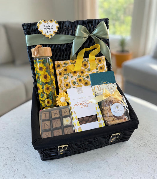 Sunflower themed thank you gift basket with chocolates, biscuits, reusable bottle and gift bag