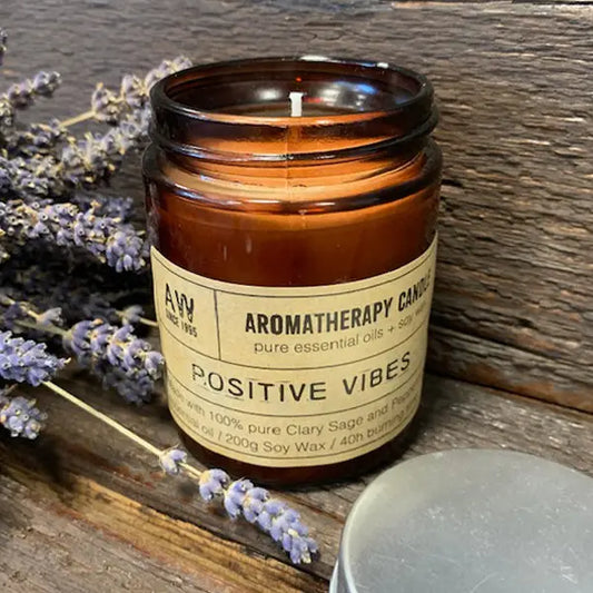 Positive Vibes aromatherapy candle in amber jar with Clary Sage and Peppermint essential oils.
