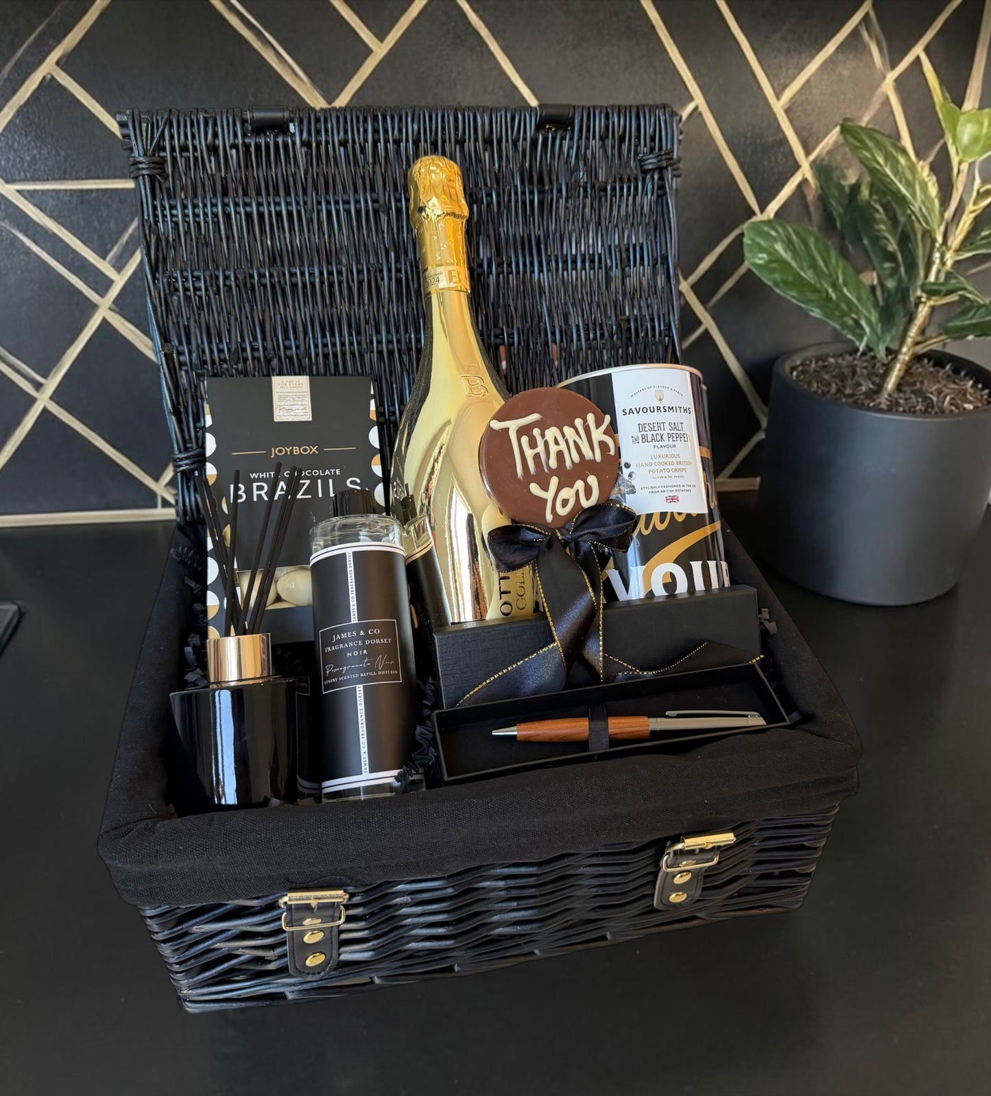 Luxury thank you hamper with chocolates, crisps, diffuser, pen set and prosecco.