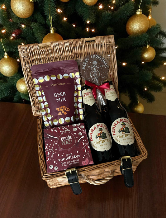 Beer and Treats Christmas Hamper with Birra Moretti bottles, chocolate snowman, beer mix, and dark chocolate snowflakes arranged in a festive gift box.