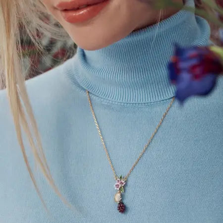 Bill Skinner Jewellery pendant featuring a field mouse on a pearlized blackberry beneath enamel flowers, suspended on an 18ct gold-plated chain.