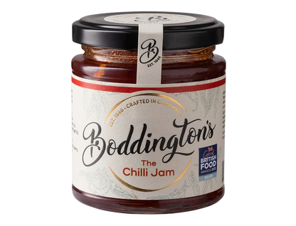 Jar of Boddingtons Chilli Jam showcasing its vibrant red colour and rustic handmade label.