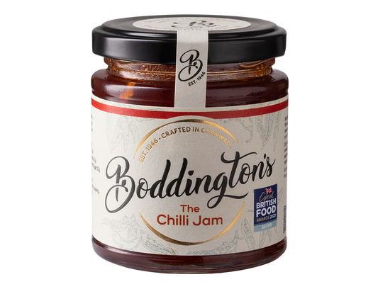 Jar of Boddingtons Chilli Jam showcasing its vibrant red colour and rustic handmade label.