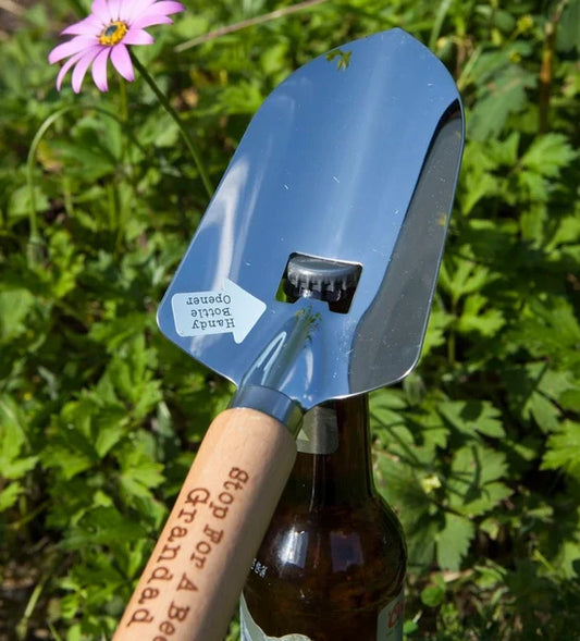 Stainless steel trowel with bottle opener and engraved wooden handle for gardening grandads.