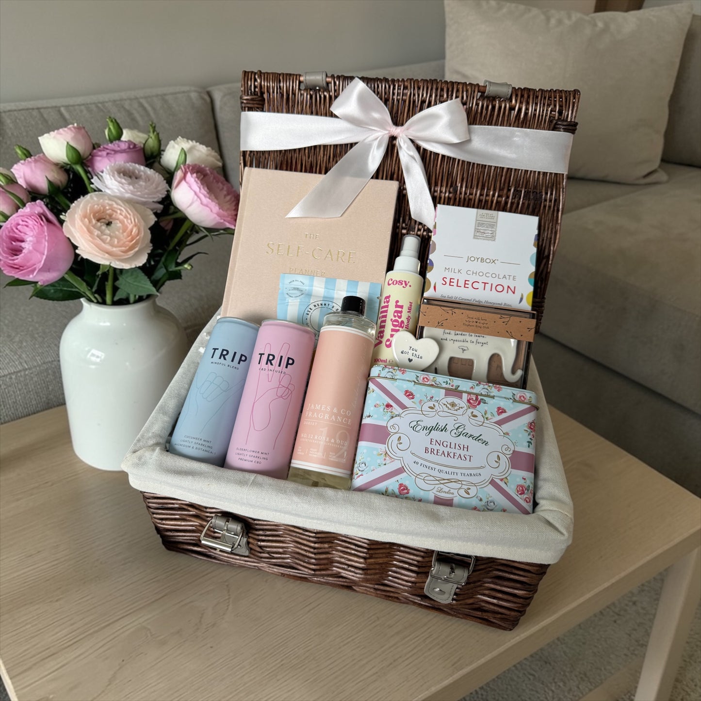 Break up self-care gift box with planner, chocolates, tea, body mist, diffuser refill and supportive keepsake.