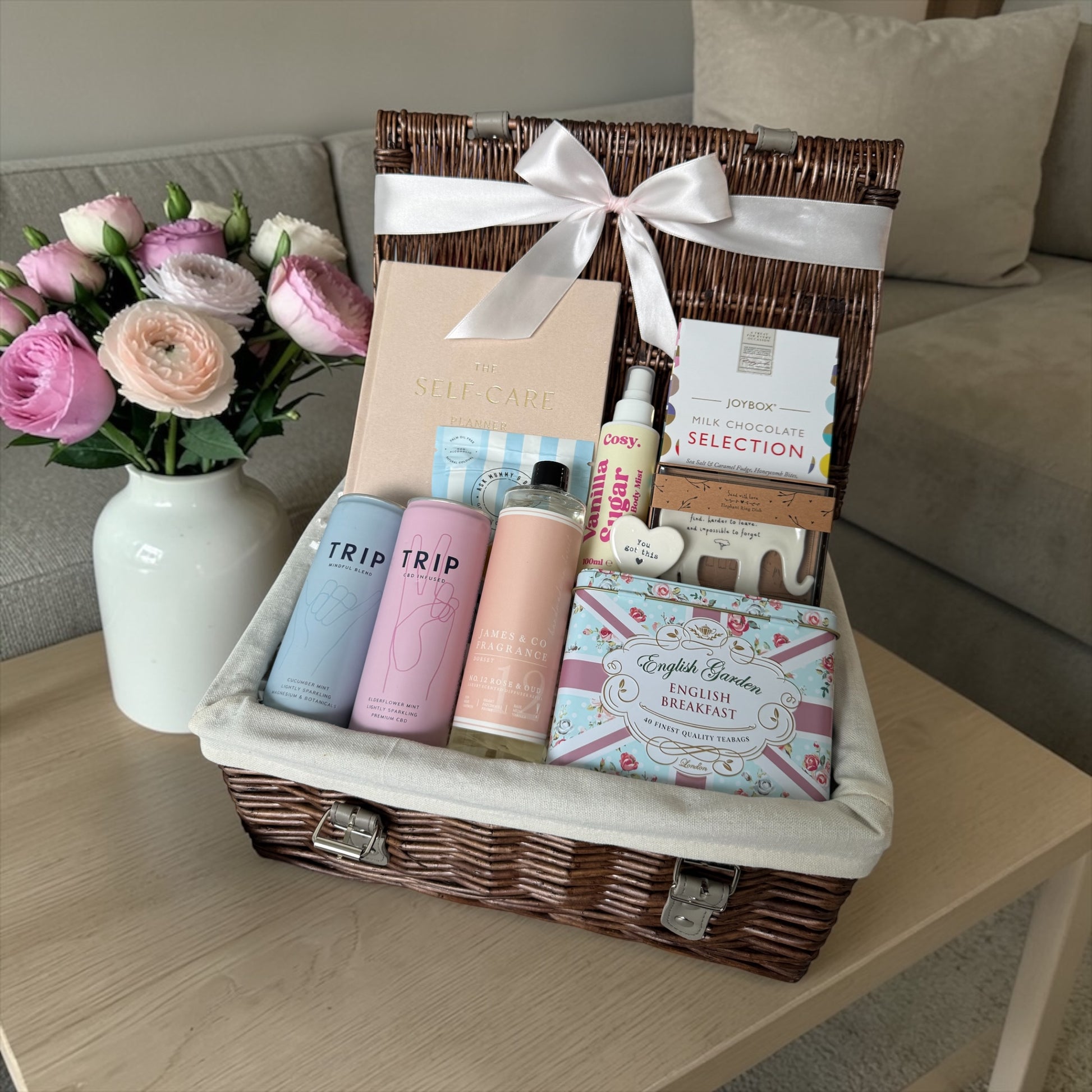 Break up self-care gift box with planner, chocolates, tea, body mist, diffuser refill and supportive keepsake.