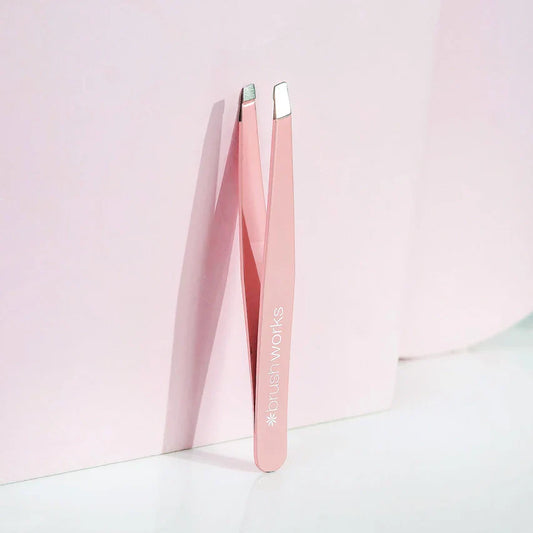 Quality Precision Pink Slanted Tweezers for effortless grooming.