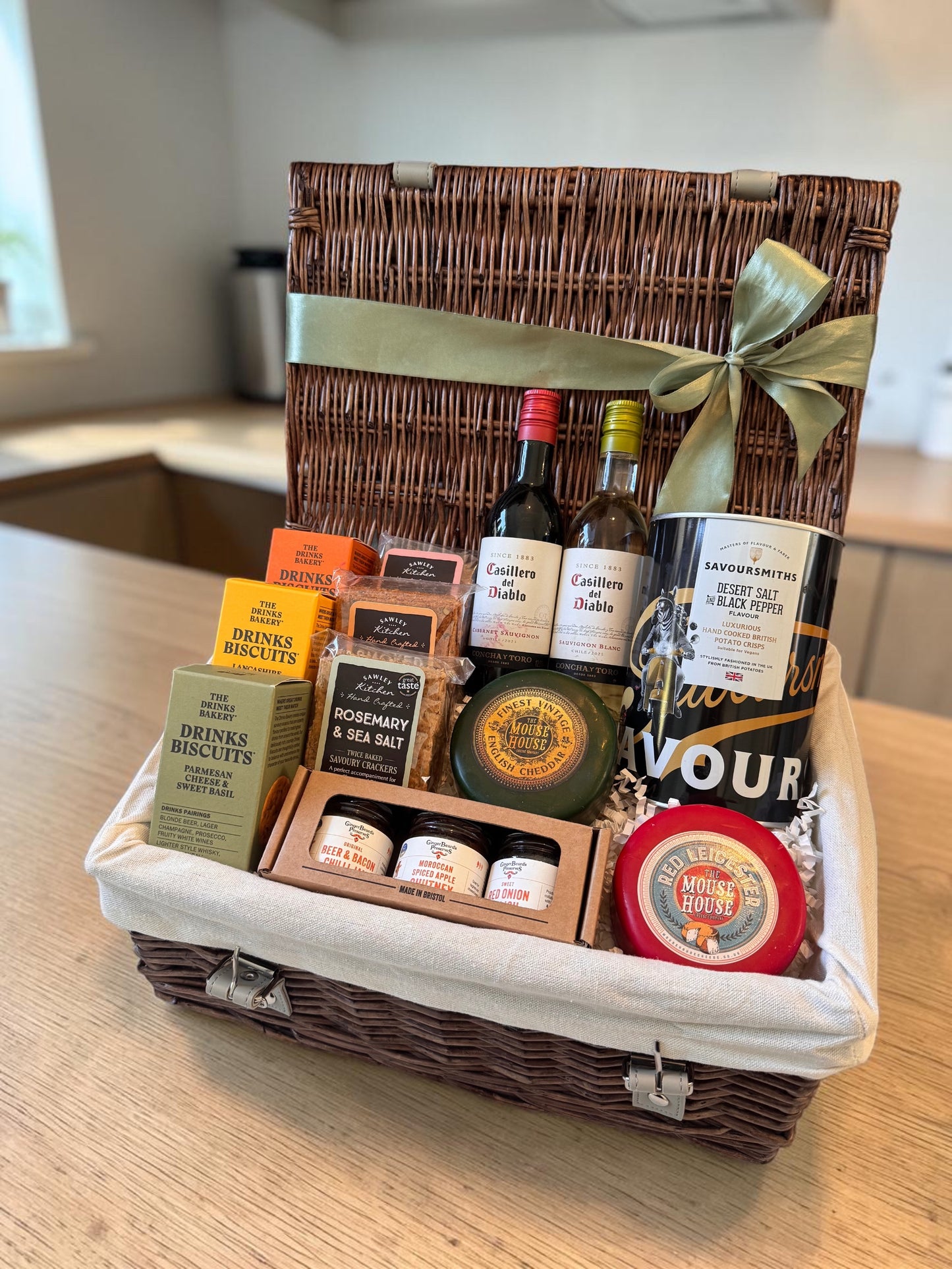 Wine and cheese gift hamper with cheddar and Red Leicester truckles, crackers, biscuits, condiments and mini wine bottles