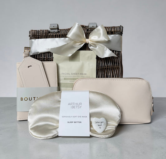 Chic Traveller gift set with satin eye mask, passport holder, makeup pouch, sheet mask and keepsake heart.