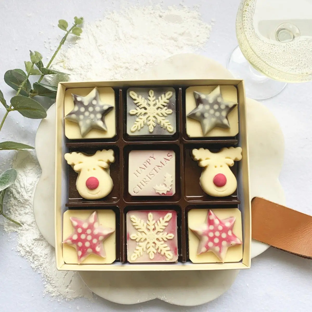 Handmade chocolates shaped like snowflakes & reindeer—ideal festive gift or stocking filler!
