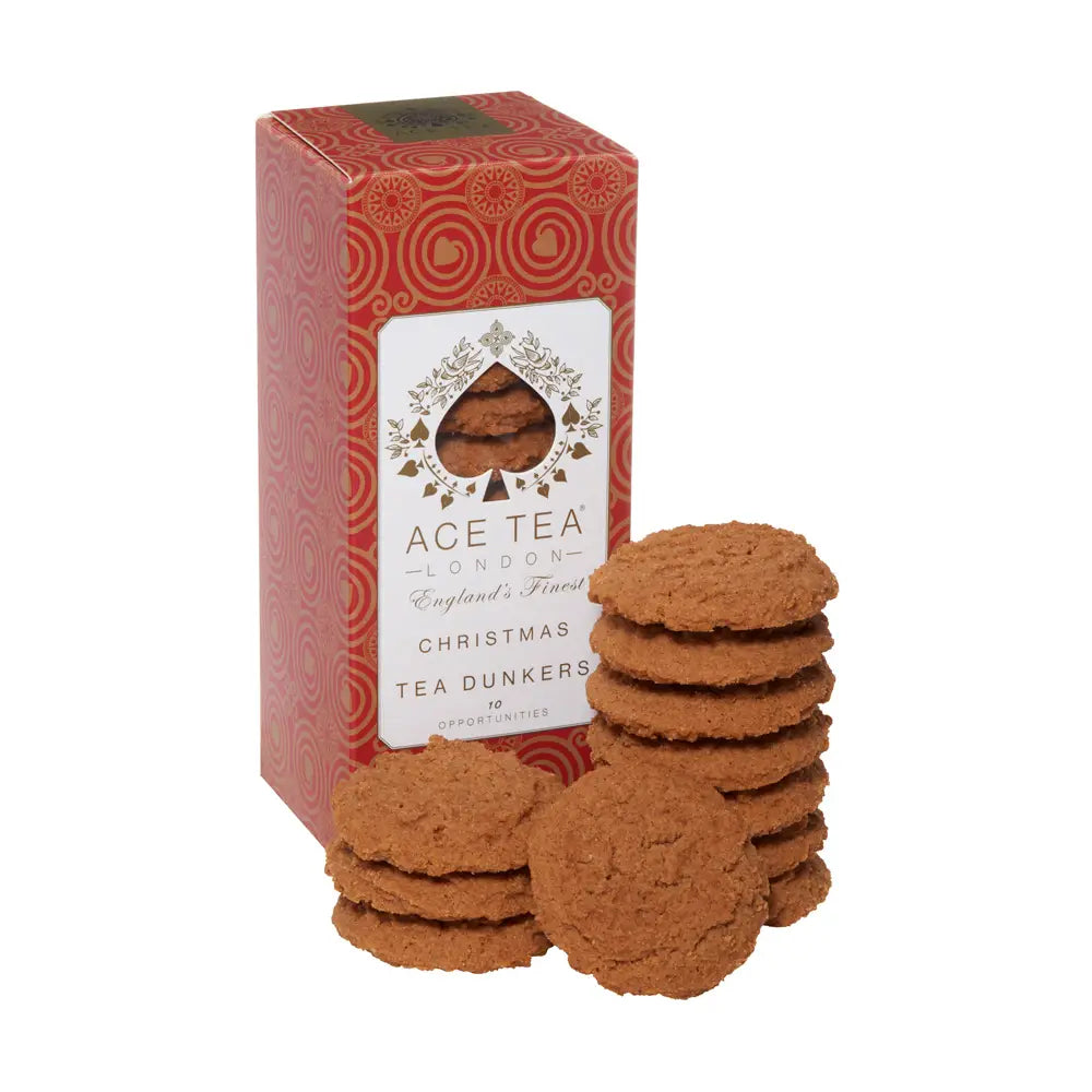 Christmas Tea Dunkers biscuits in red packaging with stacks of cookies.