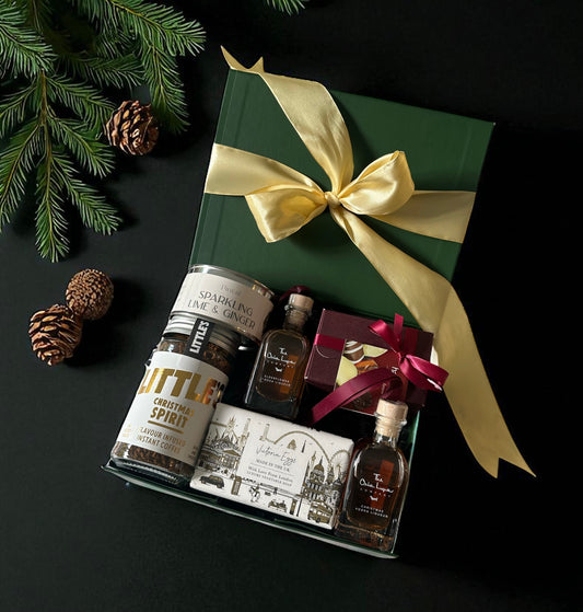 Christmas Treat Box featuring Christmas liqueur baubles, Hamiltons chocolate miniatures, Christmas Spirit coffee, lime & ginger candle, and London Soap.
