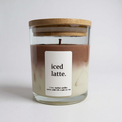 Candle labeled 'iced latte' with a wooden lid on a white background