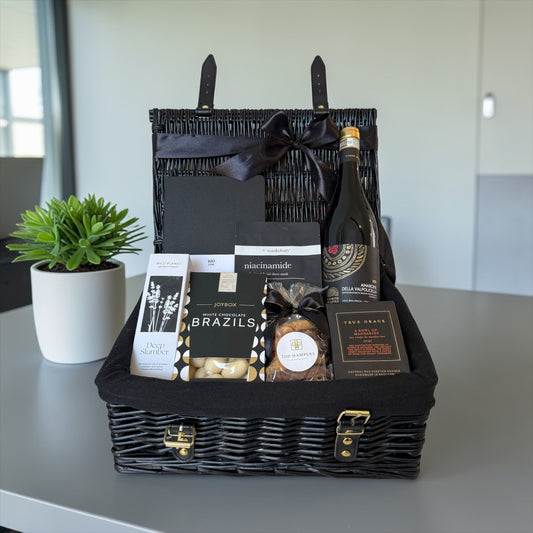 Luxury retirement gift hamper with Amarone wine, chocolates, biscuits, candle, pillow spray and planner.
