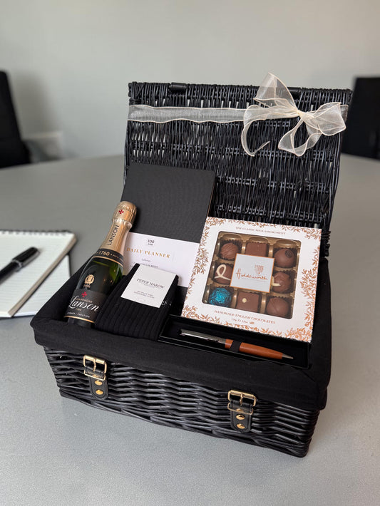 Exam results gift hamper with champagne, socks, planner, pen and chocolates