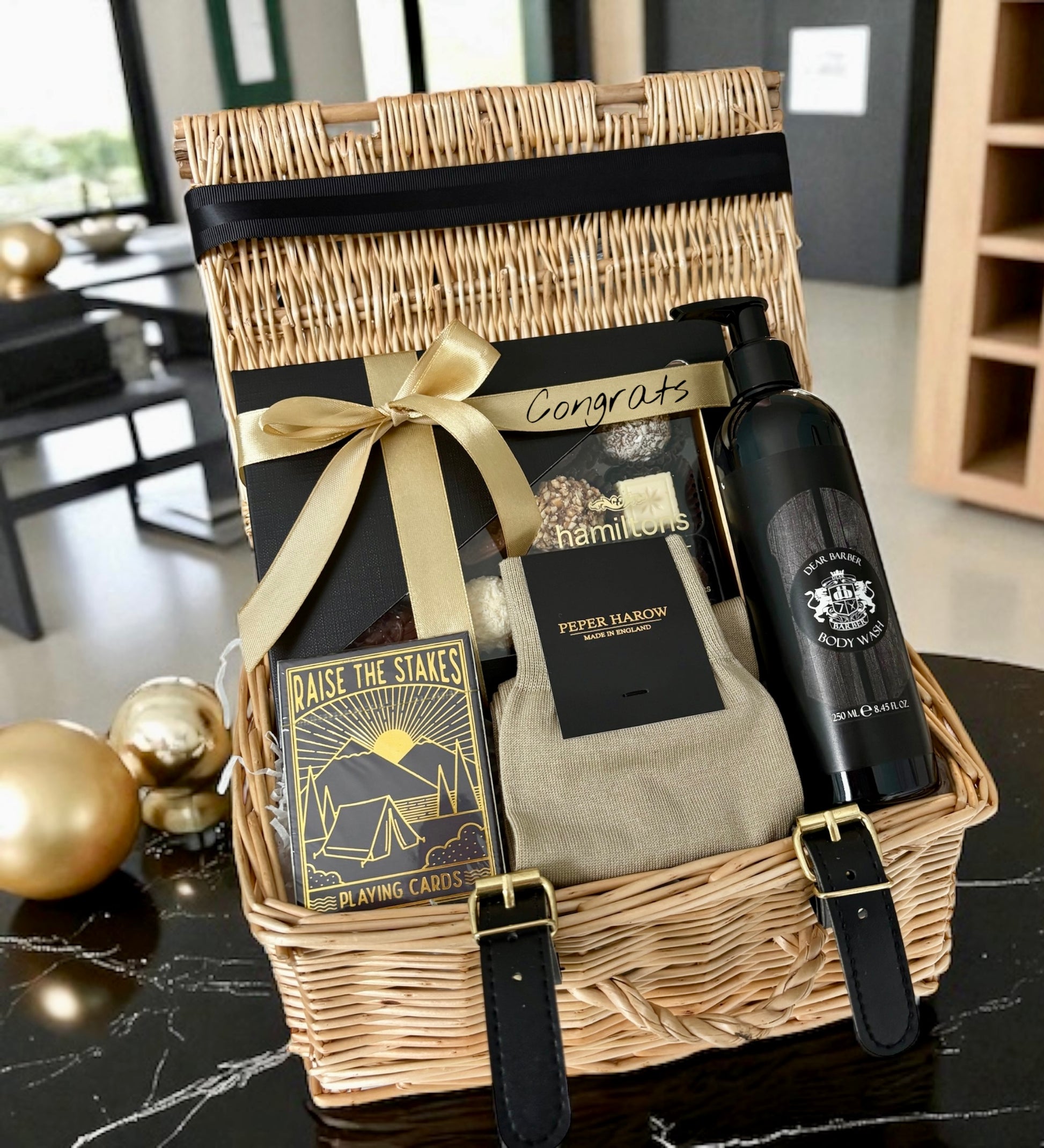 Socks, chocolates, body wash & cards — a refined gift to honour and celebrate his success.
