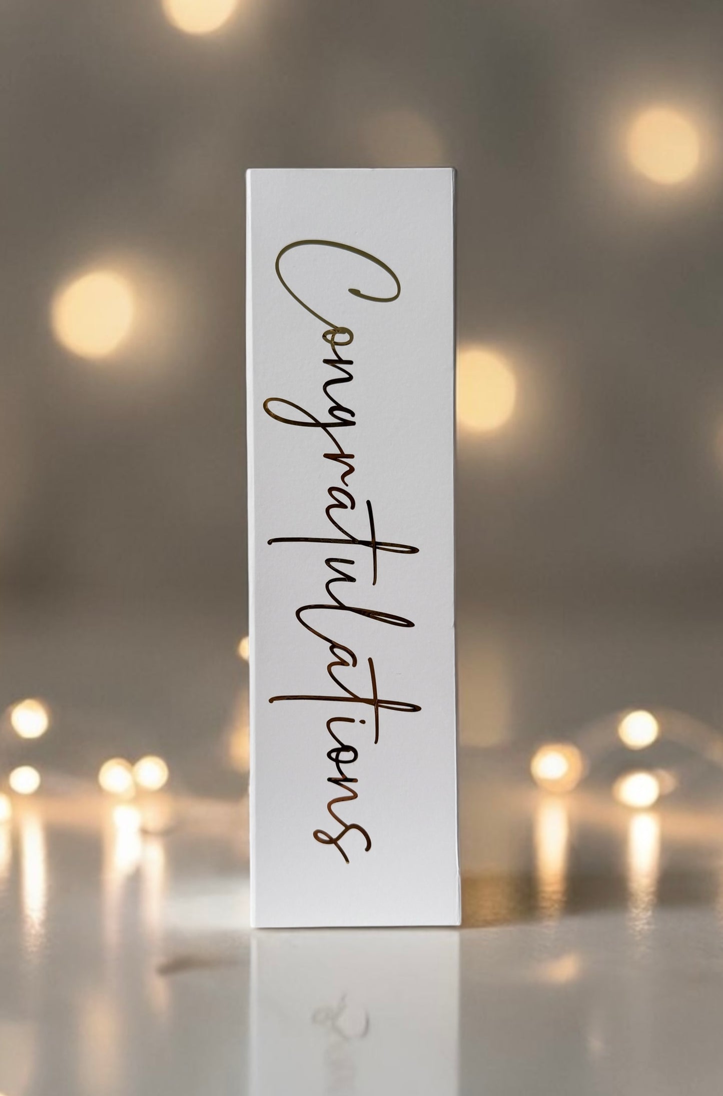 Bottle box with congratulations lettering in gold. Gift box 