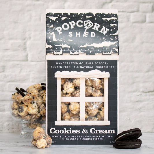 Gourmet cookies and cream popcorn coated in white chocolate flavouring and crunchy cookie crumb pieces.