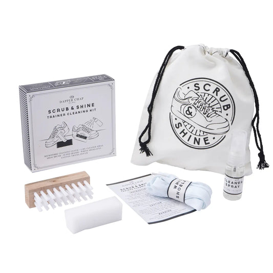 Dapper Chap Scrub & Shine Trainer Cleaning Kit in silver travel tin with shoe brush, cleaner spray, cloth, eraser, and white laces.
