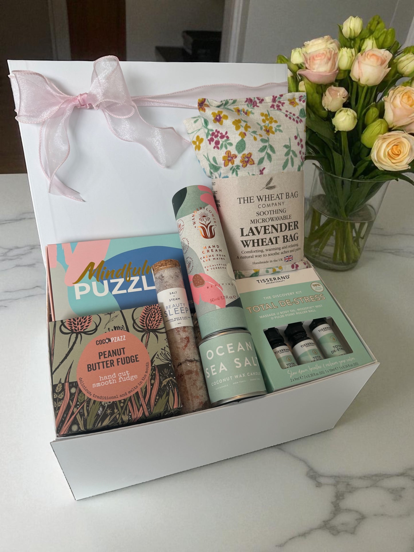 Relaxing gift box with stress kit, bath salts, hand cream, candle, puzzle cards & peanut fudge.