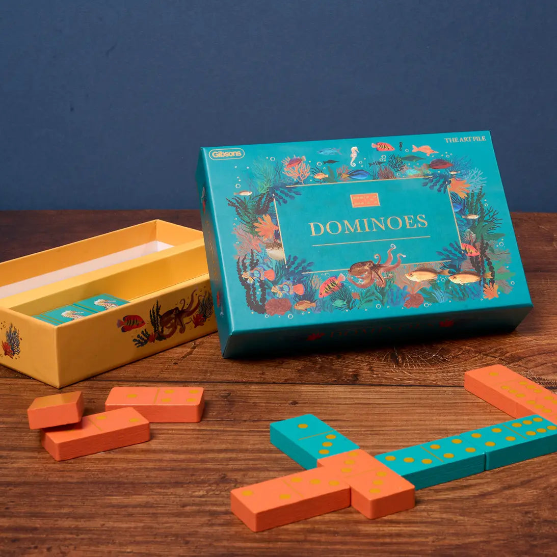 The Art File dominoes set with teal and terracotta tiles featuring sea creature illustrations.