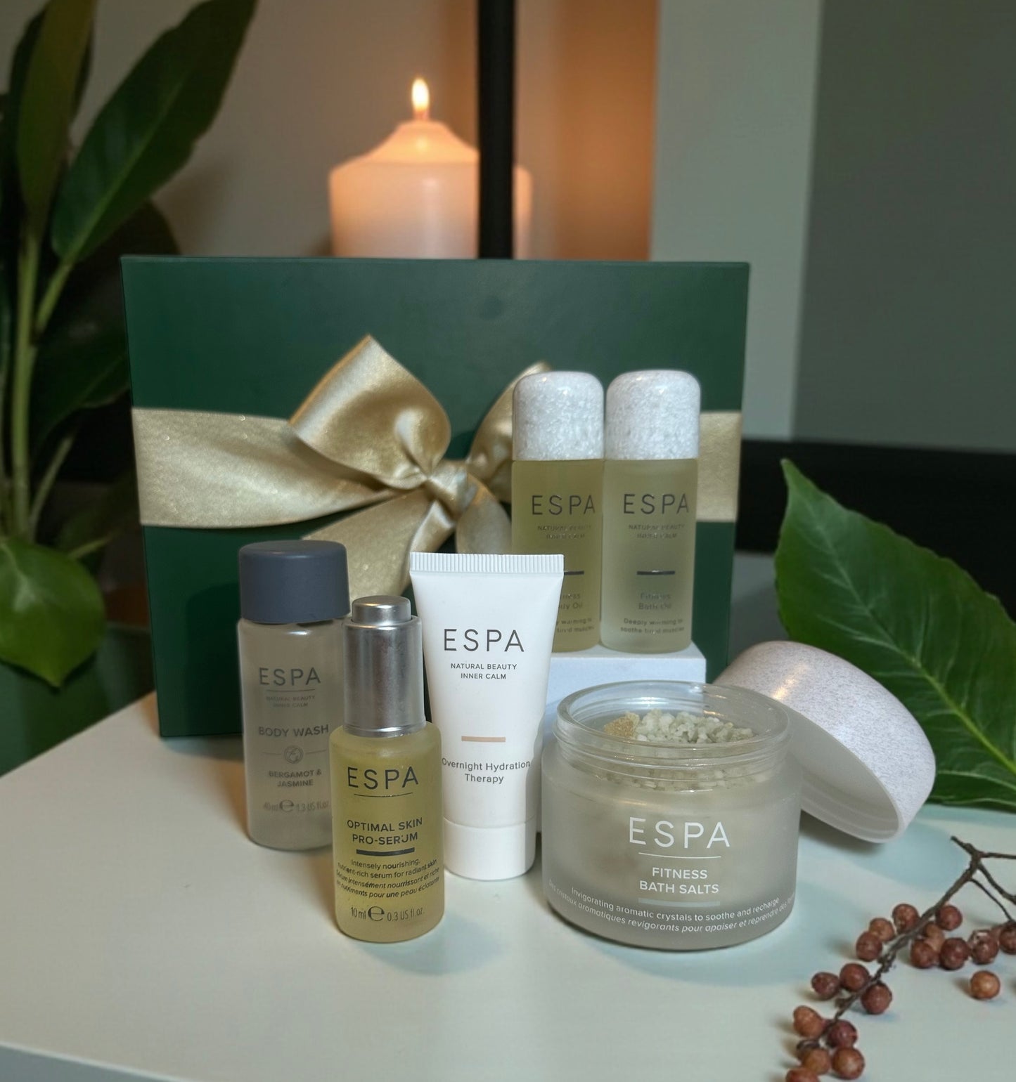 Espa skincare products on a table with a candle and decorative elements. Comes in a gift box. 