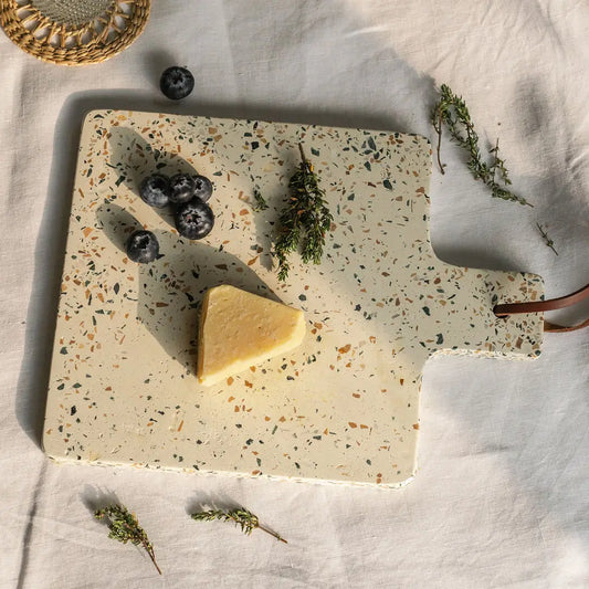 Earthy terrazzo chopping board with leather strap adds charm and style to your rustic kitchen look.