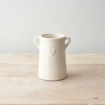 Embossed Heart Elegant Ceramic Vase with eared design on wooden surface.