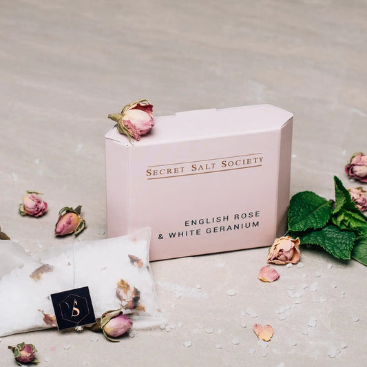English Rose and White Geranium mineral bath infusion with rose petals and Dead Sea salts.