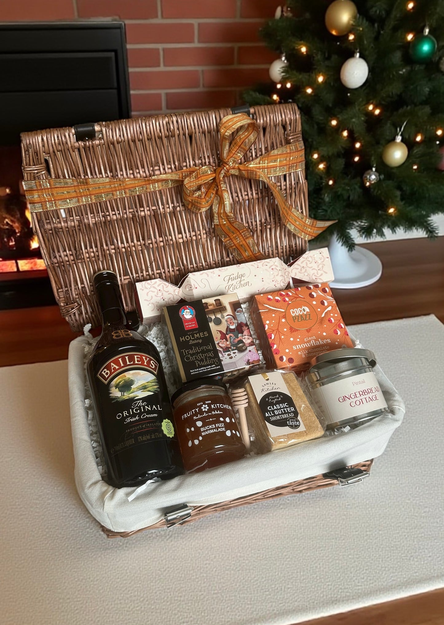 Everything Christmas Hamper with choice of Cream Sherry or Baileys, Christmas pudding, fudge, snowflakes, gingerbread candle, shortbread & Bucks Fizz marmalade.