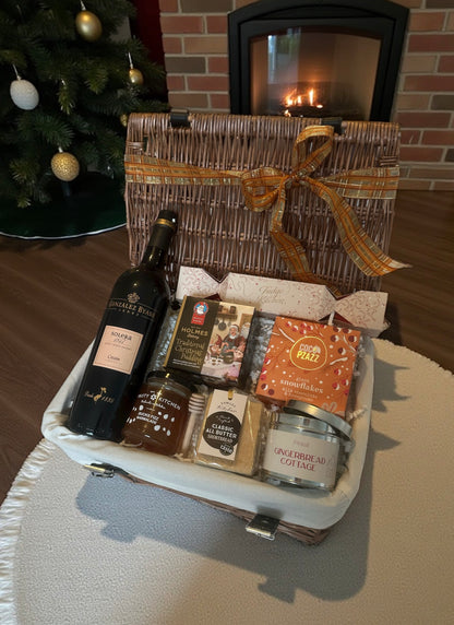 Everything Christmas Hamper with choice of Cream Sherry or Baileys, Christmas pudding, fudge, snowflakes, gingerbread candle, shortbread & Bucks Fizz marmalade.