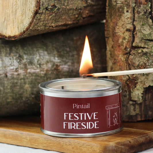 Festive Fireside Paint Pot Candle, hand-poured with smoky cade, pine, saffron, and spice notes evoking a cozy winter cabin by the fire.