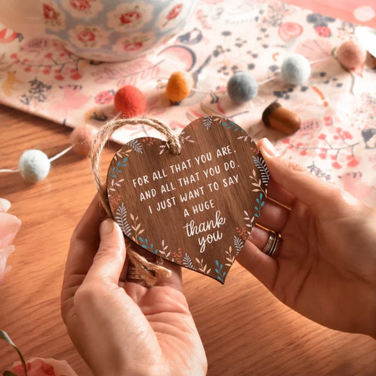 Heart shaped wooden "Thank You" decorative plaque with jute string, walnut veneer, and heartfelt message.