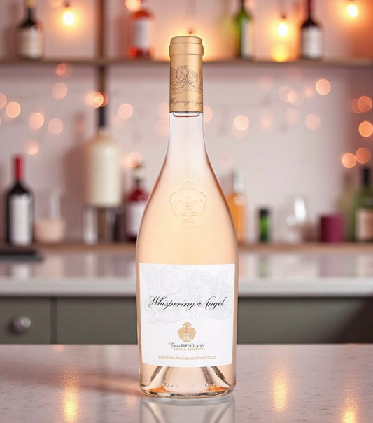 Whispering angel rose wine bottle sat on a bar 