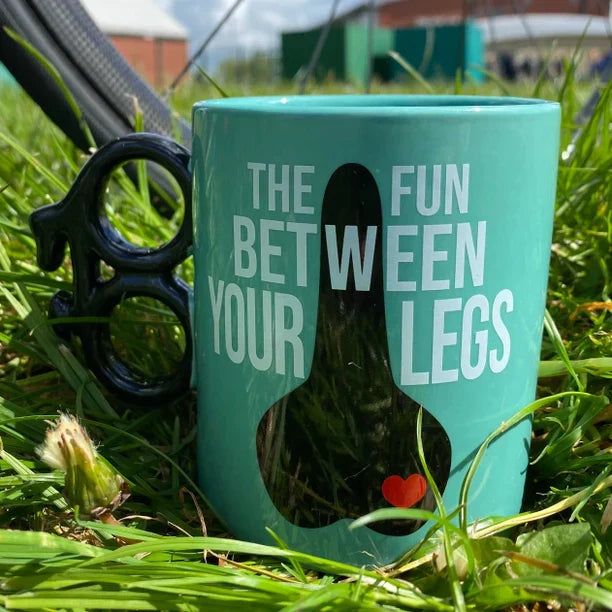 Bright blue novelty bike mug with cheeky slogan, bicycle-shaped handle, and gift box.