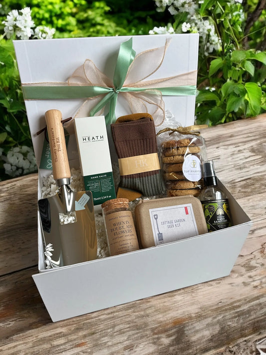 Gardeners Treats gift box with garden trowel, seed kit, seed bombs, biscuits, hand salve, hand sanitiser, and socks.