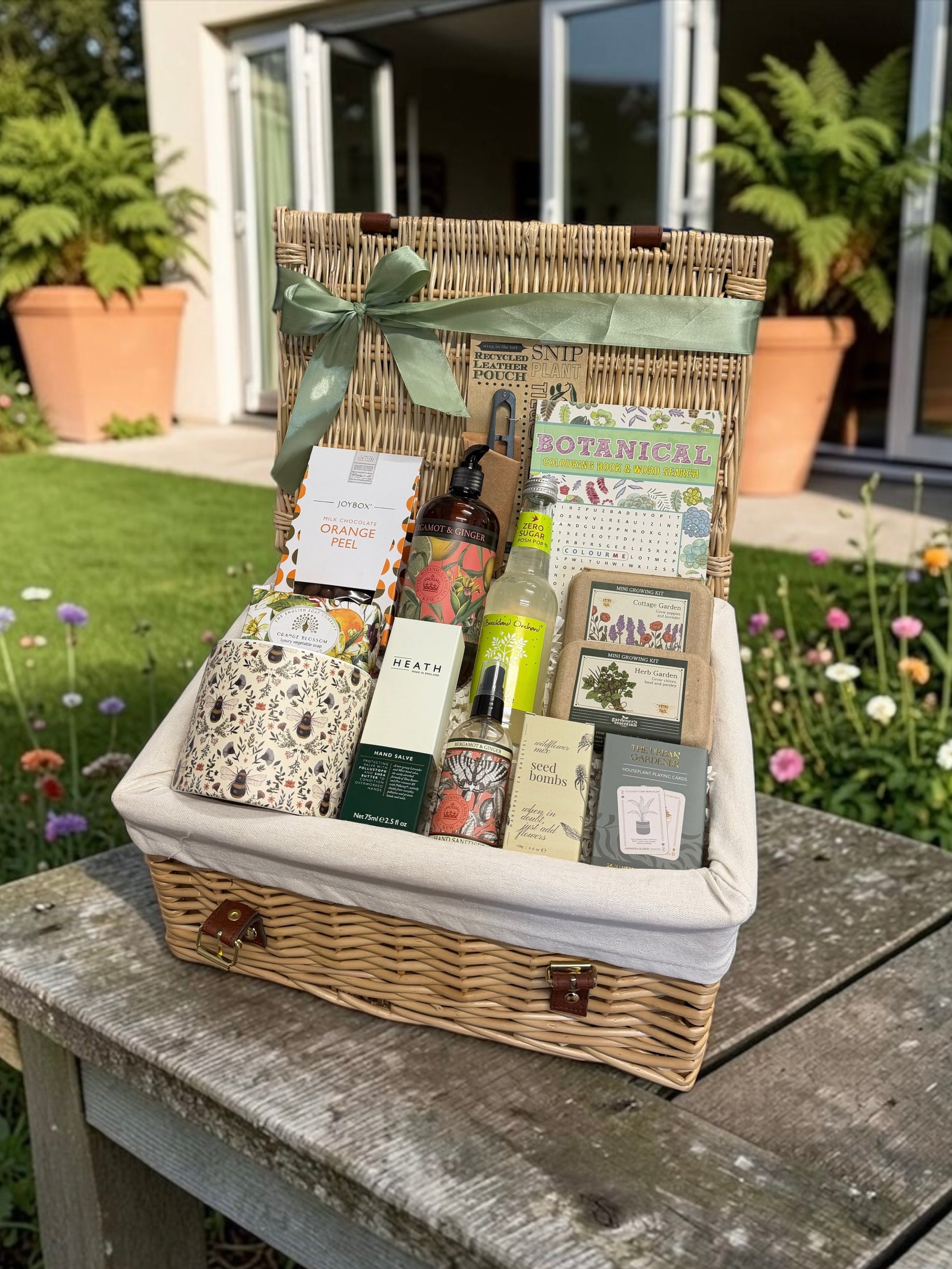 Gardening delights hamper With plant pot, seed bombs, lemonade, hand salve and gifts for a gardening enthusiast 