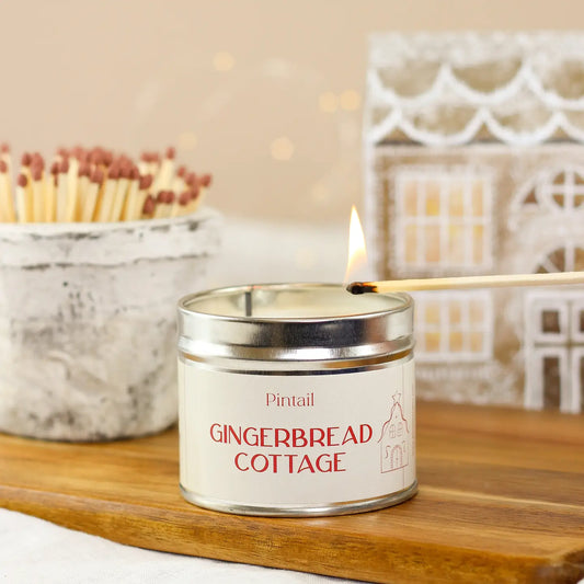 Gingerbread Cottage Classic Tin Candle with festive design and warming gingerbread scent.
